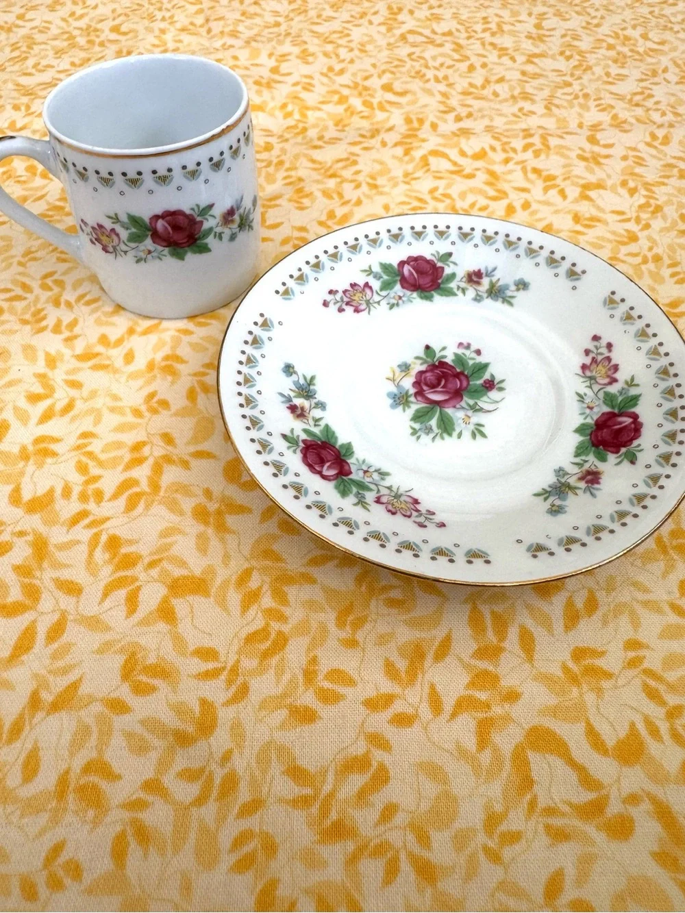 Vintage Espresso Cup and Matching Saucer. White Porcelain with Floral Motif.